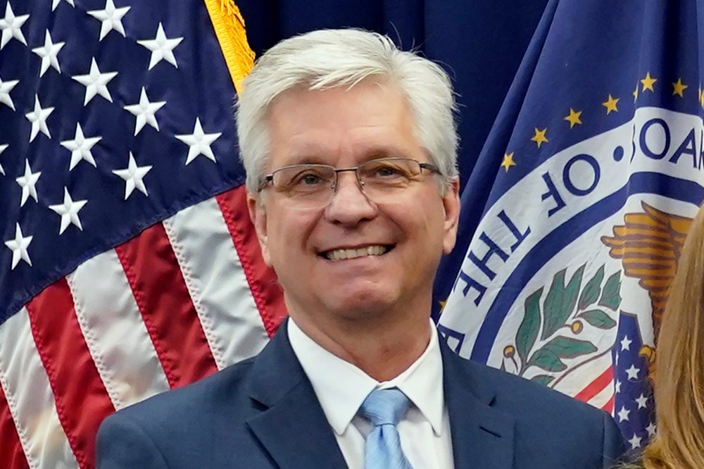 Federal Reserve Official Calls March Interest Rate Cut a ‘Coin Flip’