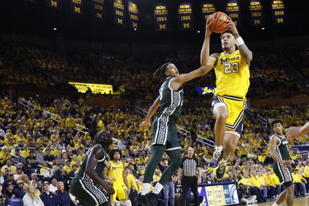 Third-Ranked Michigan Defeats Michigan State 90-80 in Big Ten Finale