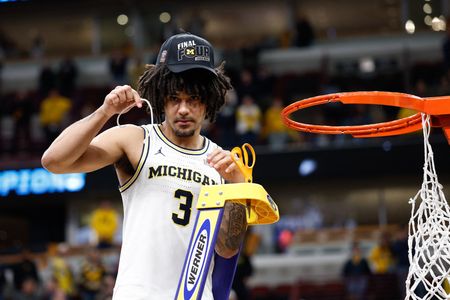Michigan Guard Cadeau Misses Team Travel Due to Food Allergy