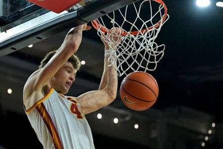 Towering 7-5 Center Returns Home to Play for Louisville Cardinals