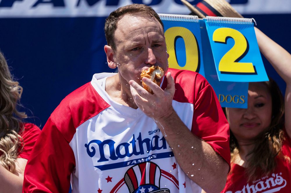 Hot Dog Eating Champion Will Compete While Serving Probation for Battery