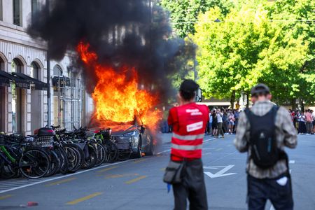 Tesla Torched, Bank Windows Smashed at Anti-G7 Protest in Geneva