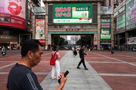 China’s Economy Shows Growing Divide: Factory Output Up, Consumer Spending Down