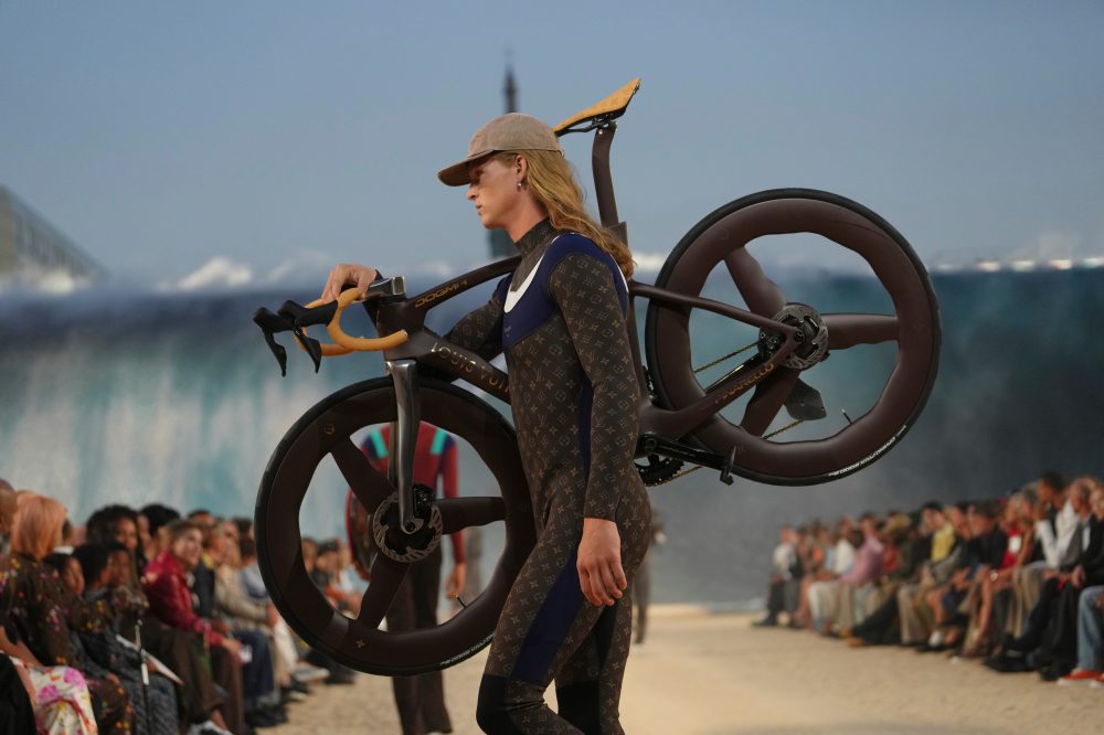 Pharrell Williams Rides a Giant Wave at Paris Fashion Week with Star-Studded Crowd