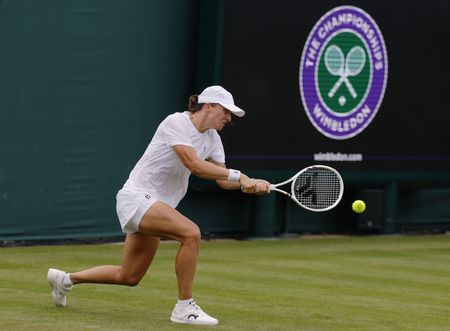 Swiatek Tempers Expectations as Wimbledon Title Defense Approaches