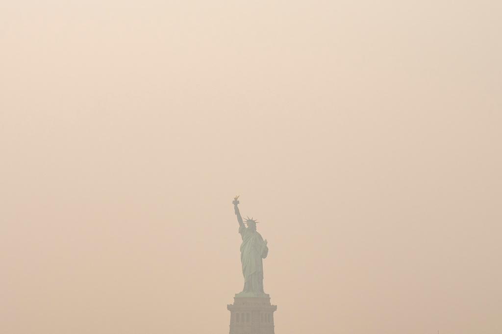 Wildfire Smoke Blankets Midwest and East Coast, Officials Warn: Stay Indoors