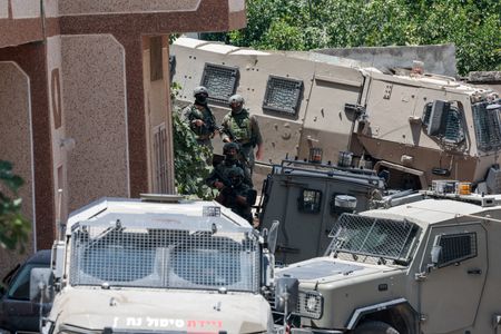 Israeli Forces Detain Dozens After Deadly West Bank Shootout Involving Settlers